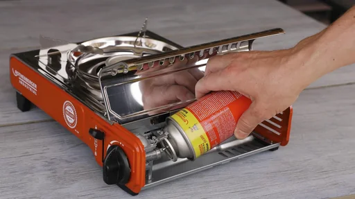 "Compact gas table cooker Deluxe RS 220 with integrated cartridge compartment image"