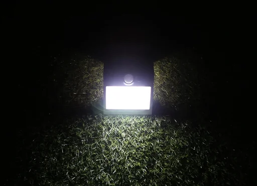 "Solar LED light with motion detector, black image"
