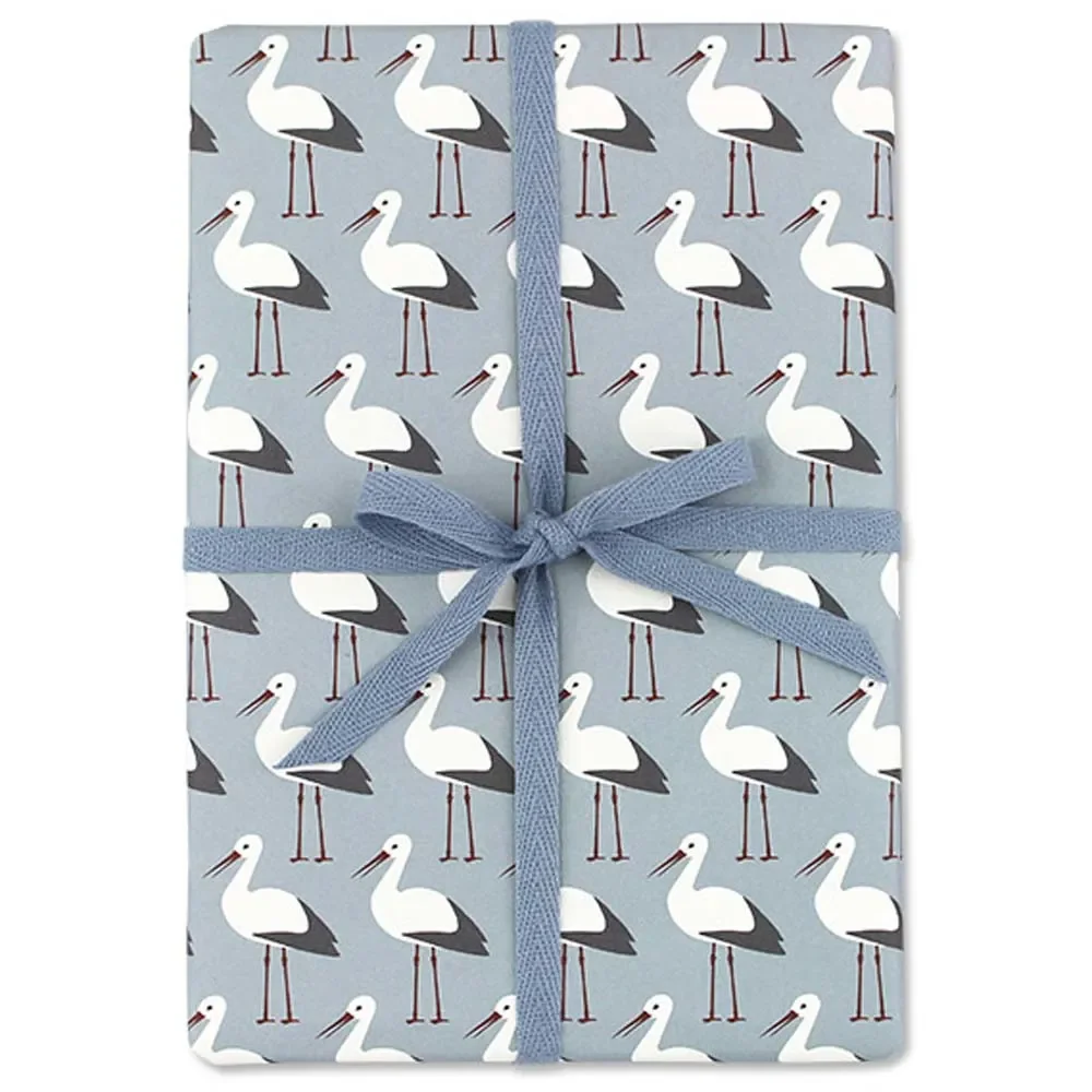 "Ava & Yves wrapping paper storks light blue image"