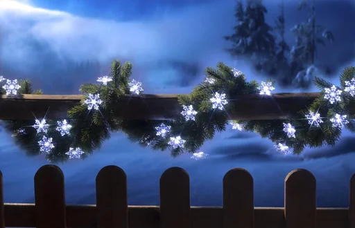 "Battery-powered fairy lights with snowflake decoration, 50 white LEDs image"