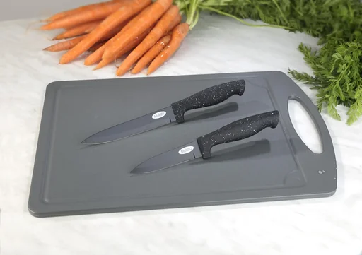 "Cutting board with paring and vegetable knife image"